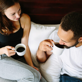 Black,And,White,Young,Couple,Drinking,Coffee,In,Bed,Together