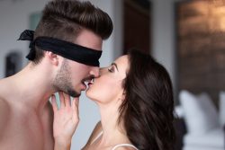 Sexy,Woman,Kissing,Young,Lover,In,Blindfold,Indoors