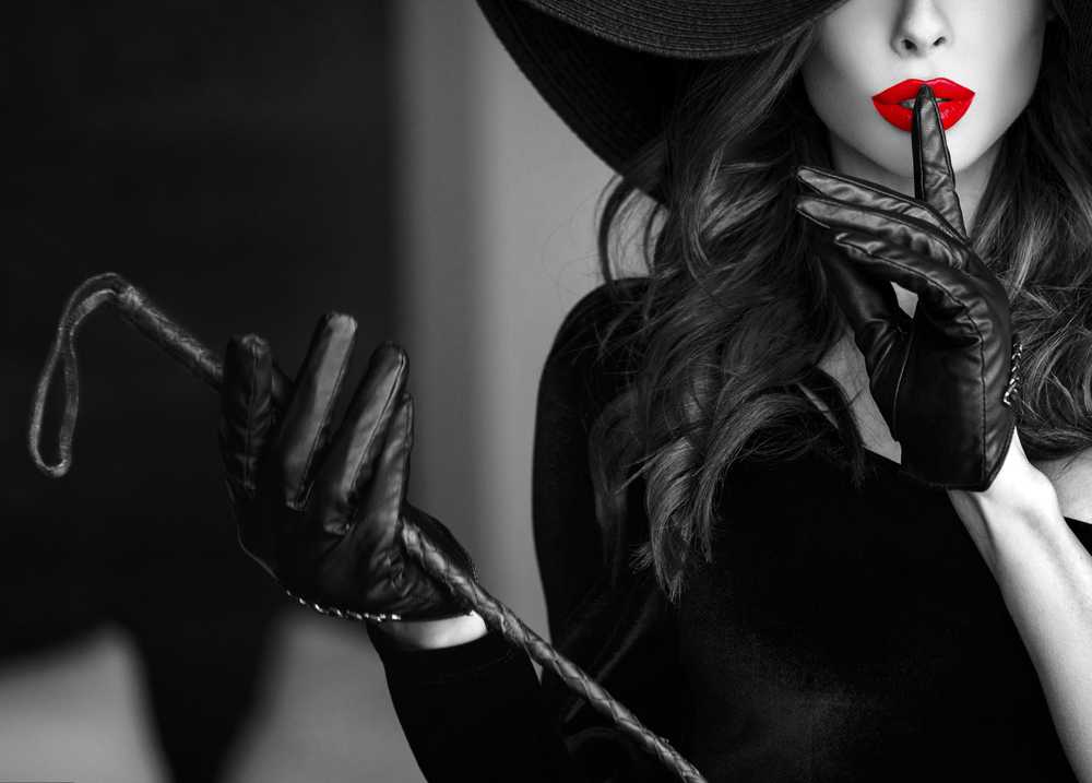 Sexy,Dominant,Woman,In,Hat,And,Whip,Showing,No,Talk